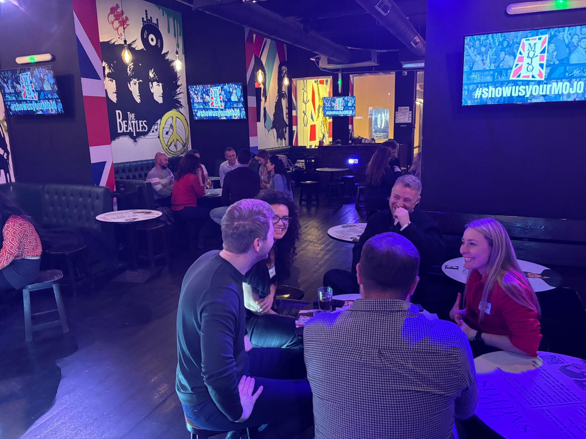 Attendees mingling and connecting at tables during the 3rd Space Bucharest event