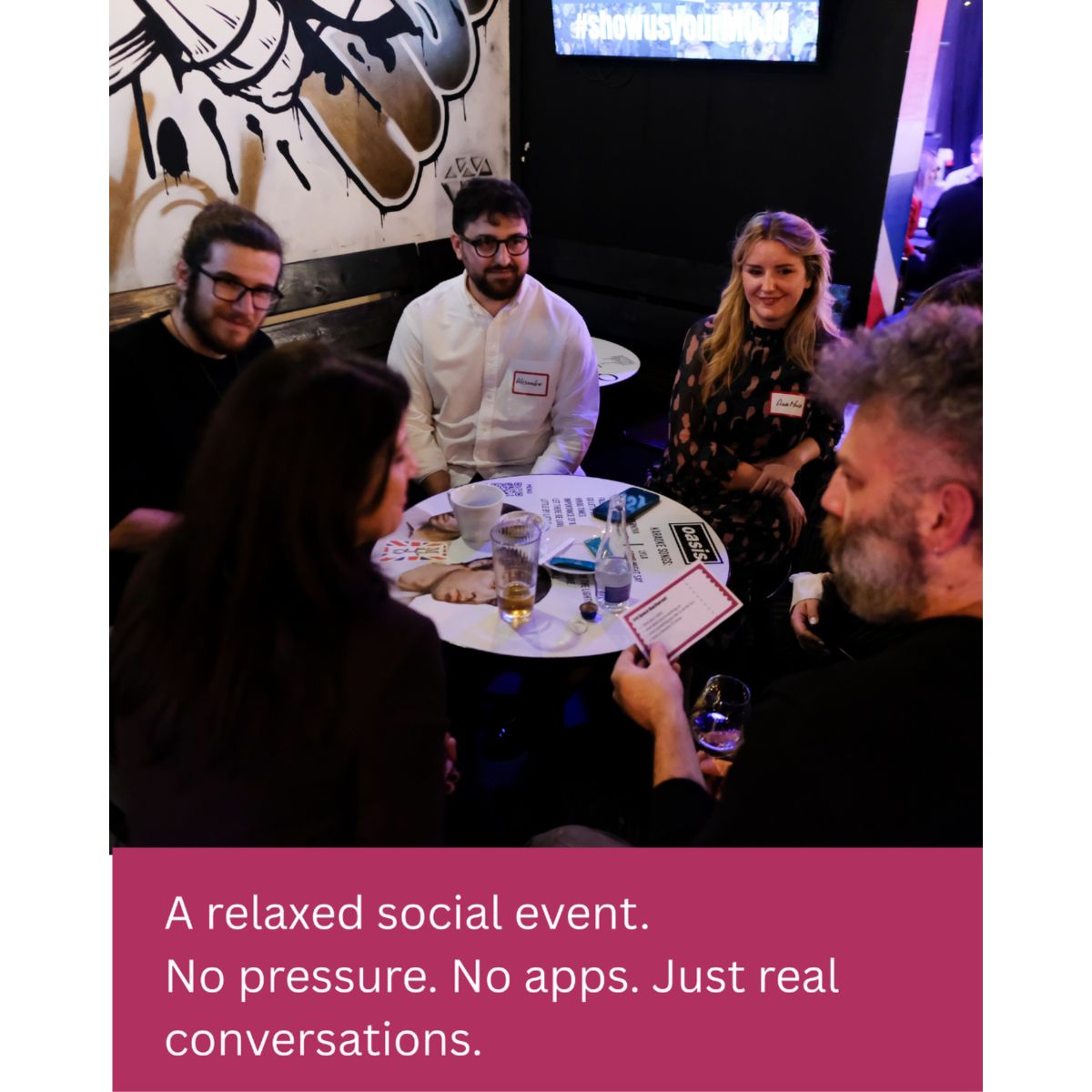Relaxed social event with guests having real conversations around a table